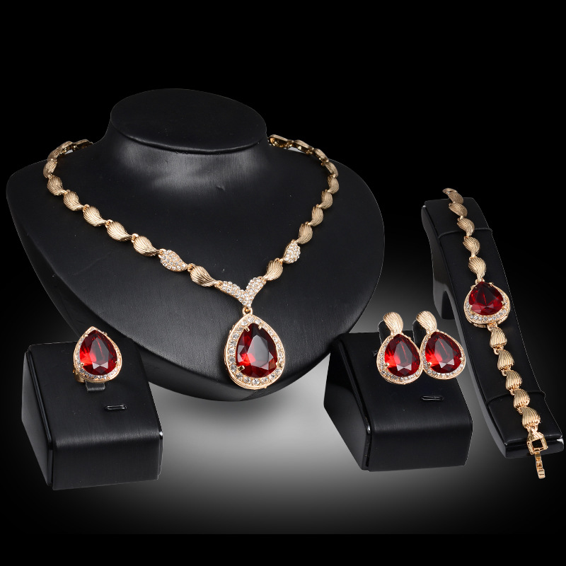 Vintage Fashion Hong Kong - Ensemble collier, boucles d'oreilles et bracelet